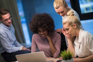 Image showing Multiethnic startup business team in night office