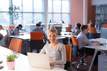 Image showing businesswoman using a laptop in startup office