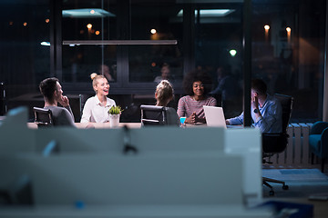 Image showing Multiethnic startup business team in night office