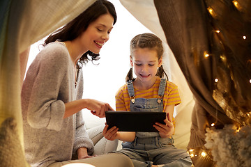 Image showing family with tablet pc in kids tent at home