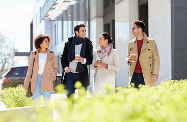 Image showing office workers with coffee on city street