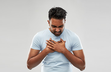 Image showing unhappy man suffering from heartache