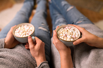 Image showing close up of couple drinking hot chocolate at home