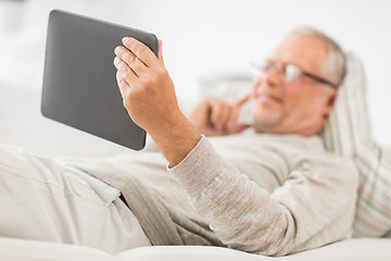 Image showing close up of senior man with tablet computer