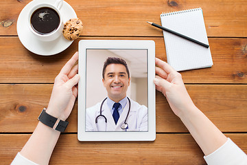 Image showing patient having video call with doctor on tablet pc