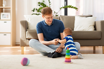 Image showing happy father with baby son at home