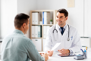 Image showing doctor giving prescription to patient at hospital