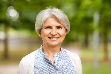 Image showing portrait of happy senior woman at summer park