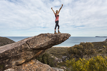 Image showing Hiker in national park arms outstretched feel on top of the world