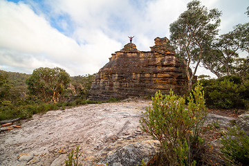 Image showing Hiker on top of a rocky pagoda castle