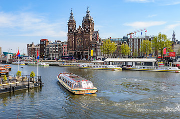 Image showing Sightseeng at Canal Boats near the Central Station of Amsterdam