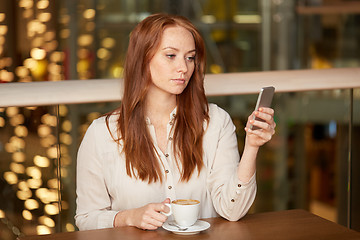 Image showing woman with coffee and smartphone at restaurant