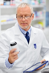 Image showing senior with tablet pc at pharmacy