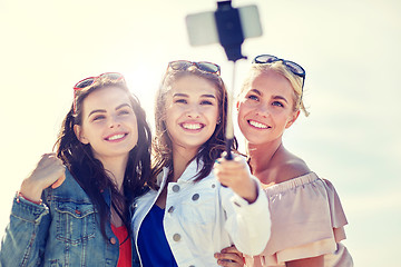 Image showing group of smiling women taking selfie on beach