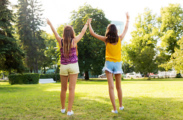 Image showing teenage girls showing peace hand sign at park