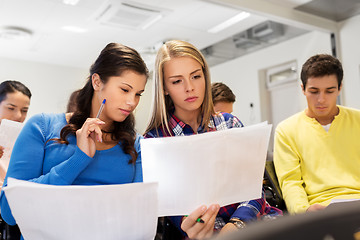 Image showing student girls with tests at lecture hall