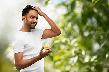 Image showing indian man applying hair wax or styling gel