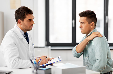 Image showing patient showing sore shoulder to doctor at clinic