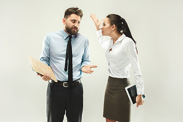 Image showing Angry boss. Woman and secretary standing at office or studio