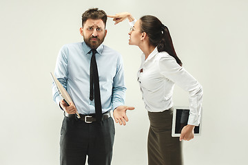 Image showing Angry boss. Woman and secretary standing at office or studio