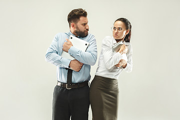 Image showing Angry boss. Woman and secretary standing at office or studio