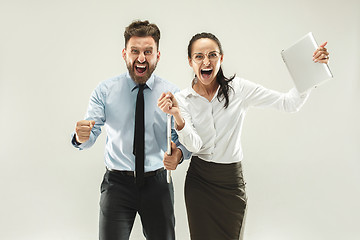 Image showing Winning success woman and man happy ecstatic celebrating being a winner.