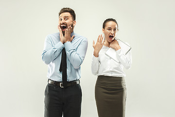 Image showing Happy boss. Man and his secretary standing at office