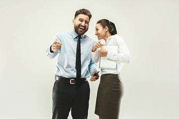 Image showing Happy boss. Man and his secretary standing at office