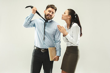 Image showing Angry boss. Man and his secretary standing at office or studio