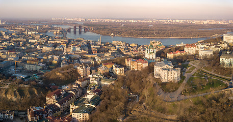 Image showing A bird\'s eye view, aerial view shooting from drone of the Podol district, oldest historical center of Kiev, Ukraine, the Dnieper River and the left bank of Dnieper