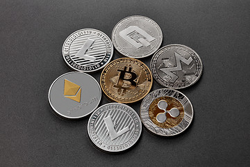 Image showing Coins of crypto currency are presented on a dark background. Virtual money concept.