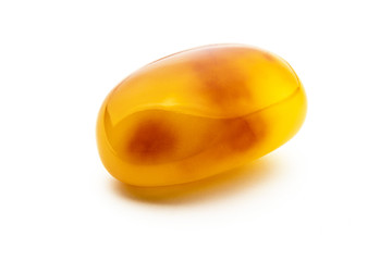 Image showing Natural amber. A piece of yellow opaque natural amber on white background.