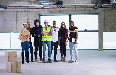 Image showing multiethnic business people in group, architect and engineer on 