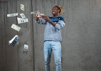 Image showing black businessman making the rain of money