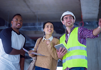 Image showing multiethnic business people,architect and engineer on constructi