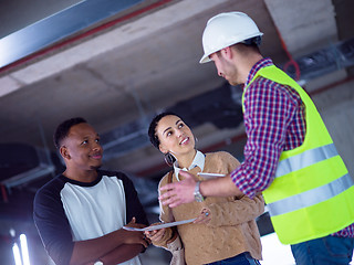 Image showing multiethnic business people,architect and engineer on constructi