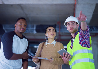 Image showing multiethnic business people,architect and engineer on constructi