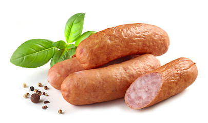 Image showing smoked sausages on white background