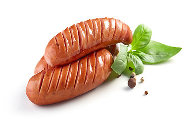 Image showing grilled sausages on white background