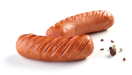 Image showing grilled sausages on white background