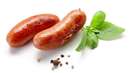 Image showing grilled sausages on white background