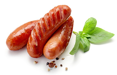 Image showing grilled sausages on white background