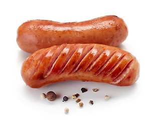 Image showing grilled sausages on white background