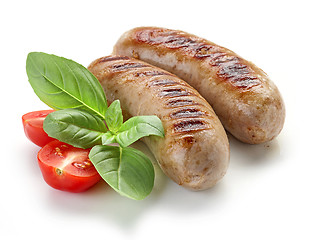 Image showing grilled sausages on white background