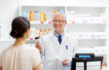 Image showing apothecary with cure and customer at pharmacy