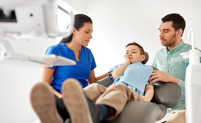 Image showing father and son visiting dentist at dental clinic