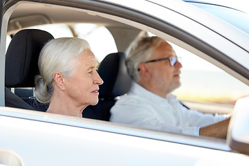 Image showing happy senior couple driving in car