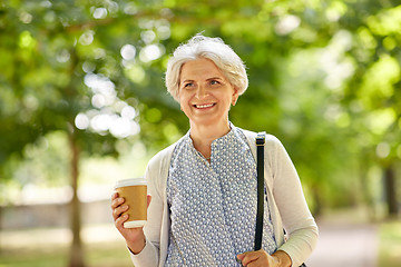 Image showing senior woman drinking takeaway coffee at park