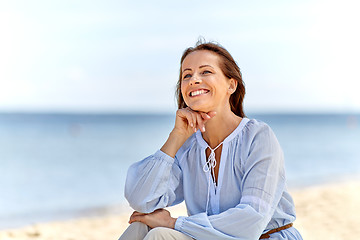 Image showing happy smiling woman on summer beach