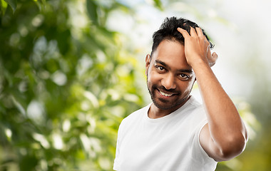 Image showing indian man touching his hair